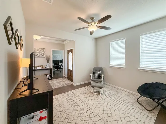 a bedroom with furniture and a window