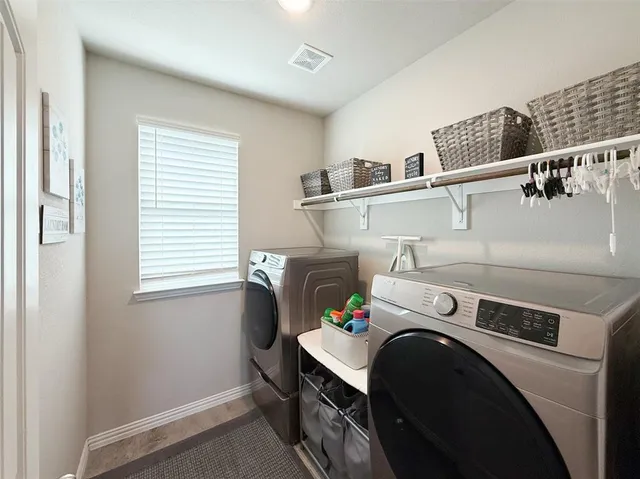 a view of a kitchen with a refrigerator