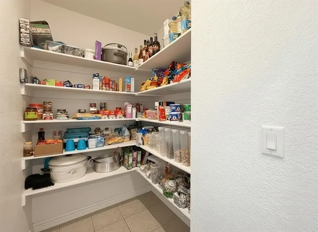 a view of a swimming pool and lounge chairs