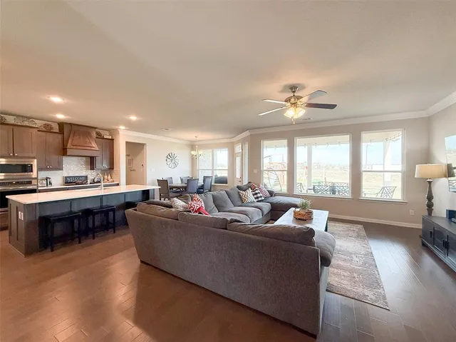 a large kitchen with a table and chairs