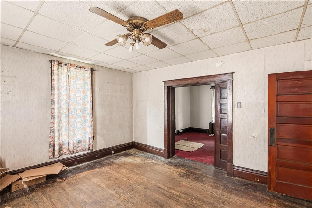 103 Wash Run Road White, PA 15490 - Photo 24 of 35 a view of a room with wooden floor and ceiling fan
