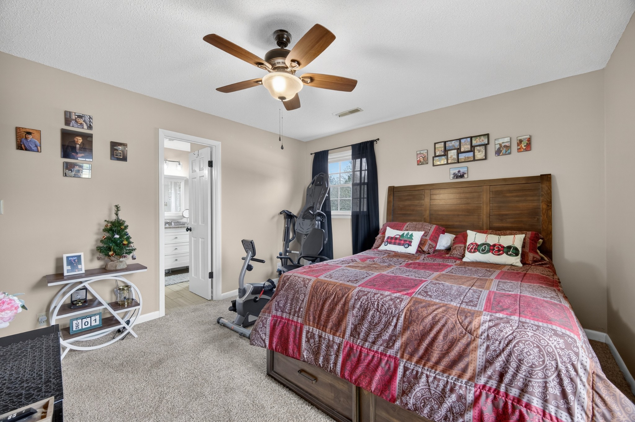 5 Camper Creek Road Fayetteville, TN 37334 - Photo 26 of 51 a bedroom with a bed and a chandelier