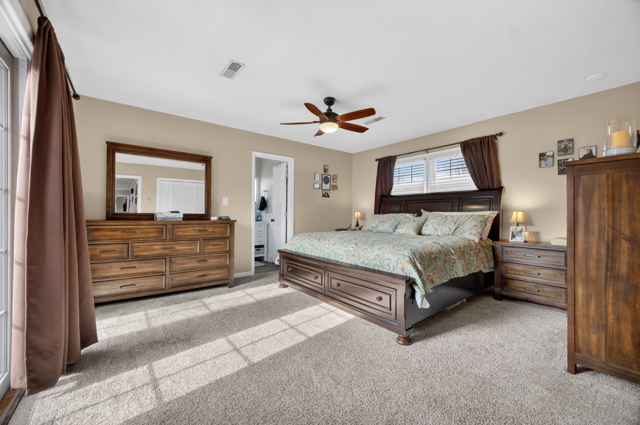 5 Camper Creek Road Fayetteville, TN 37334 - Photo 30 of 51 a bedroom with a bed and a chandelier