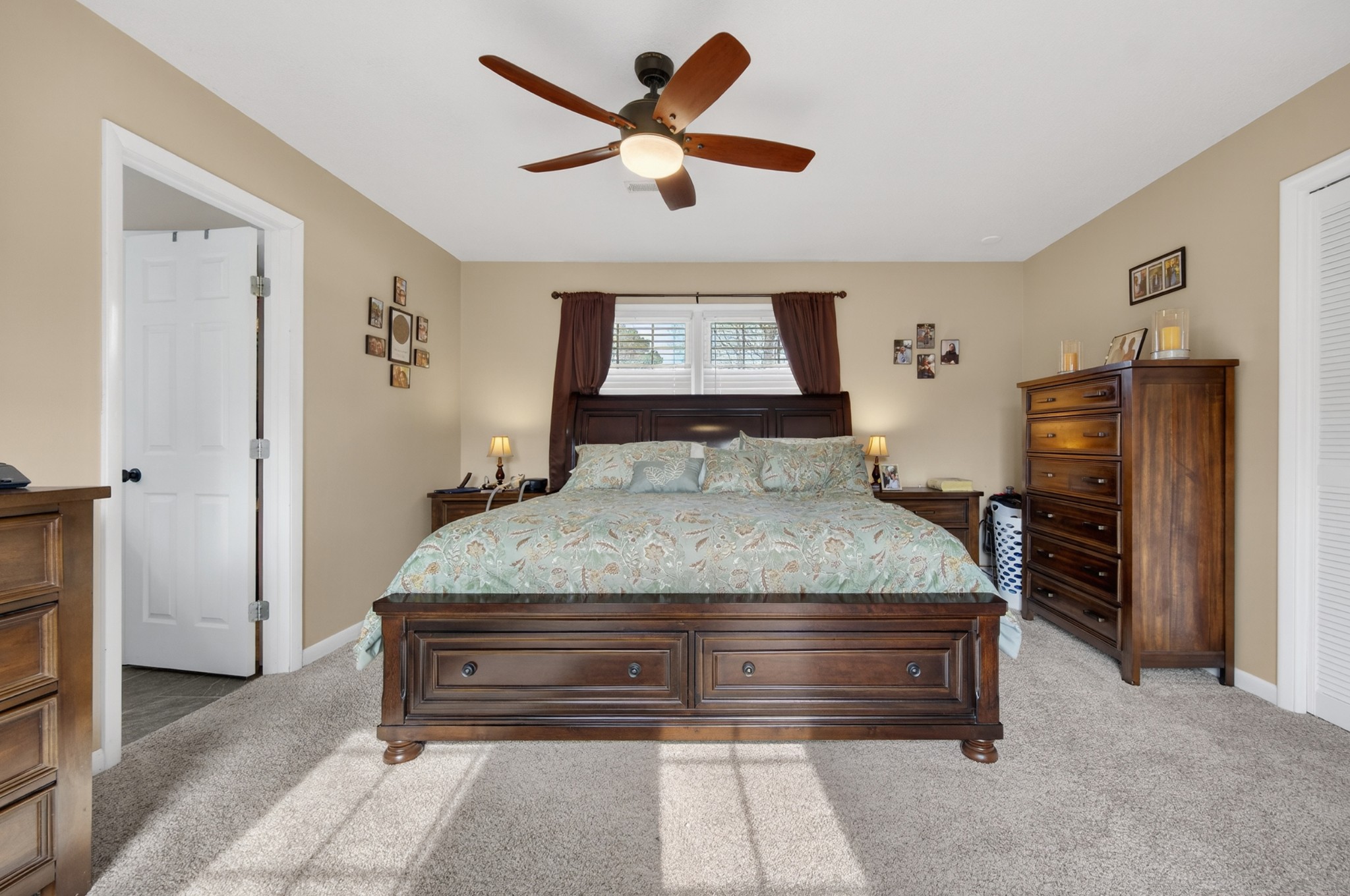 5 Camper Creek Road Fayetteville, TN 37334 - Photo 31 of 51 a bedroom with a bed and a chandelier