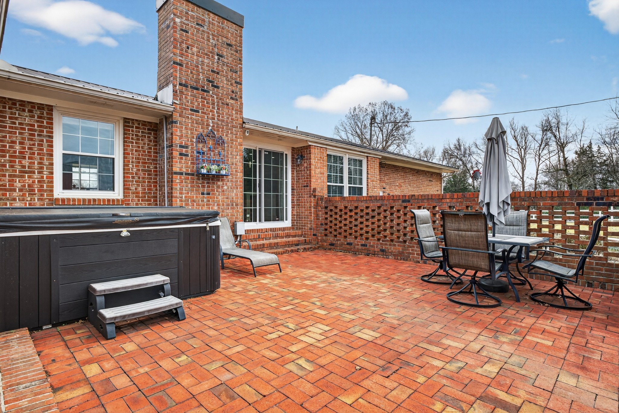 5 Camper Creek Road Fayetteville, TN 37334 - Photo 41 of 51 a backyard of a house with barbeque oven table and chairs