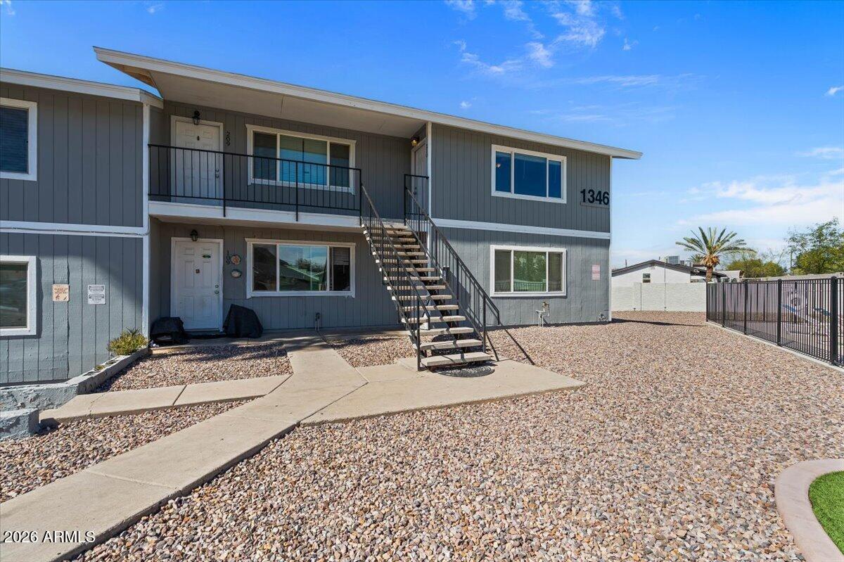 1346 East Mountain View Road, Unit 209 Phoenix, AZ 85020 - Photo 1 of 31 a front view of a house with a yard