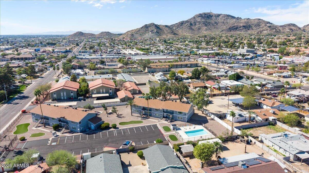 1346 East Mountain View Road, Unit 209 Phoenix, AZ 85020 - Photo 11 of 31 an aerial view of residential houses with outdoor space