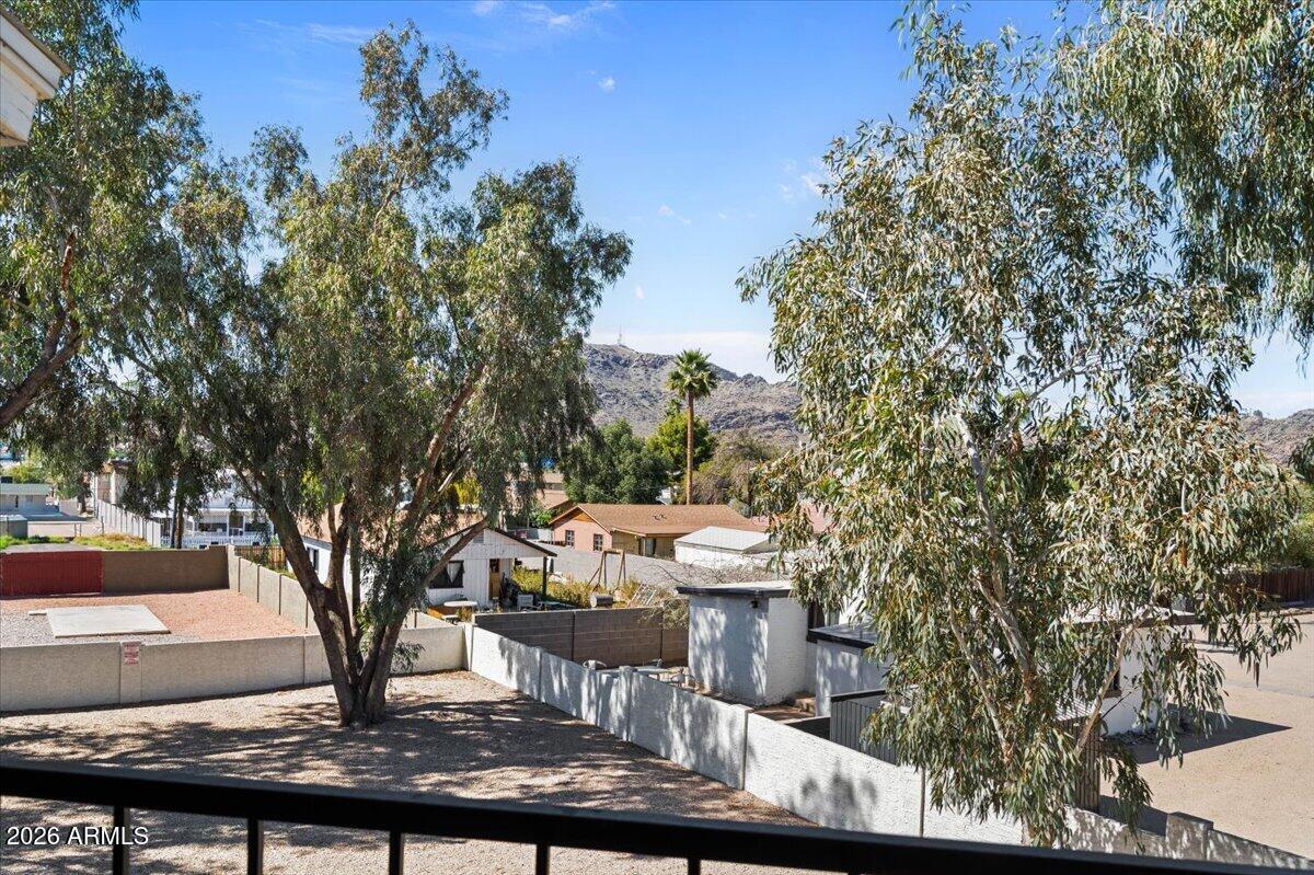 1346 East Mountain View Road, Unit 209 Phoenix, AZ 85020 - Photo 4 of 31 a view of a house with backyard fountain and sitting area