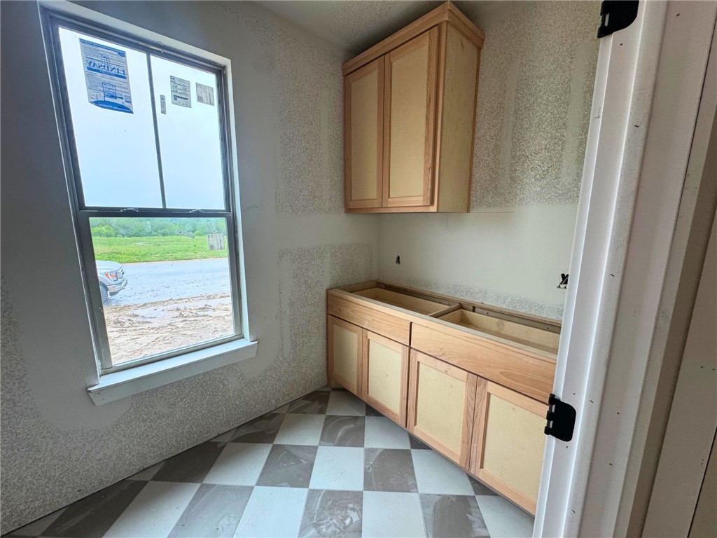 162 Buffalo Rdg Road Giddings, TX 78942 - Photo 6 of 13 a utility room with a window dryer and washer