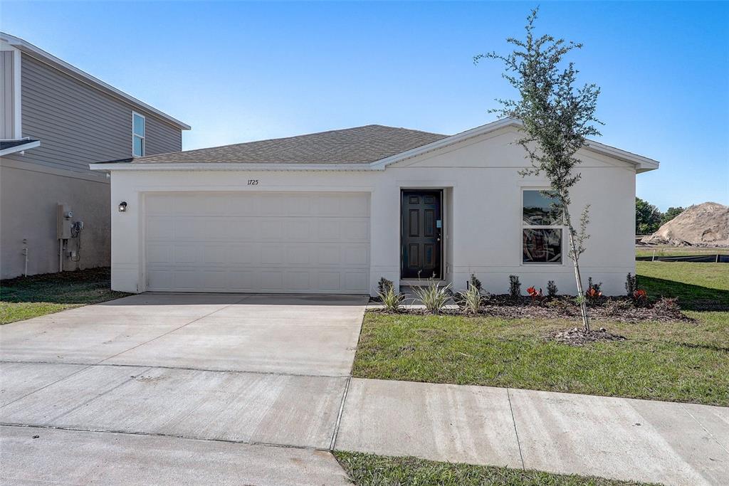 1725 Ohio Road Sumterville, FL 33585 - Photo 1 of 1 a front view of house with yard