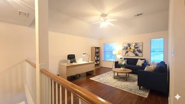 a living room with furniture and a chandelier