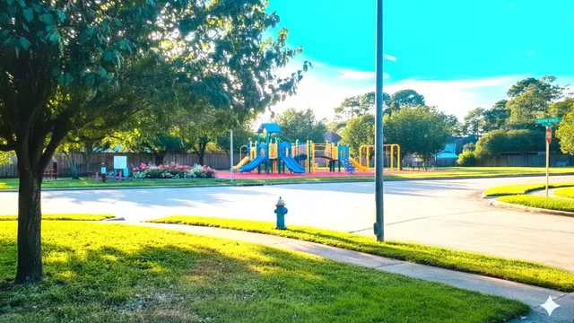 a view of a swimming pool with a yard and palm trees