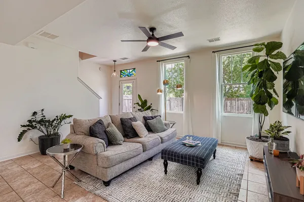 a living room with furniture and a large window