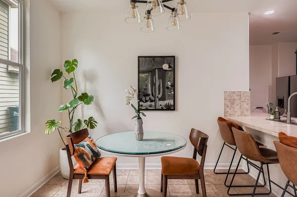 a view of a dining room with furniture window and wooden floor