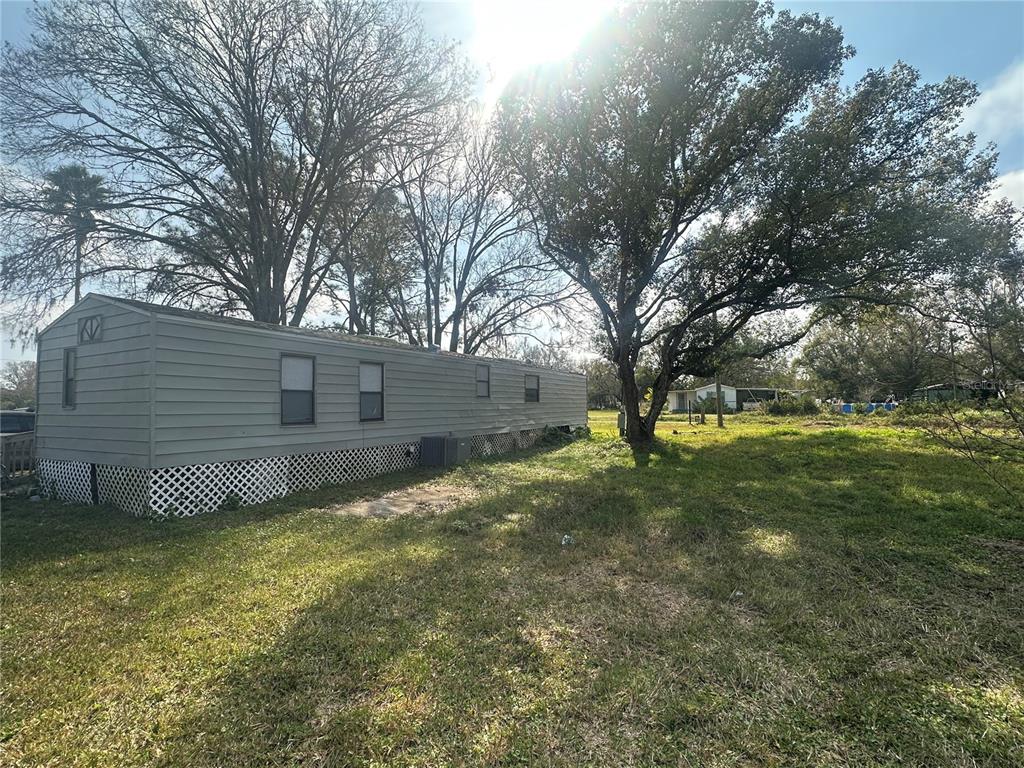 2218 Ellie Road, Unit 1 Auburndale, FL 33823 - Photo 17 of 21 a view of a yard with large tree