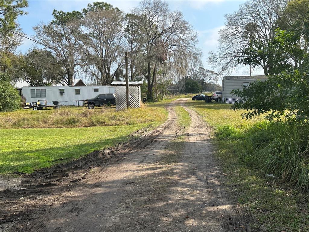 2218 Ellie Road, Unit 1 Auburndale, FL 33823 - Photo 19 of 21 a view of yard with swimming pool and green space