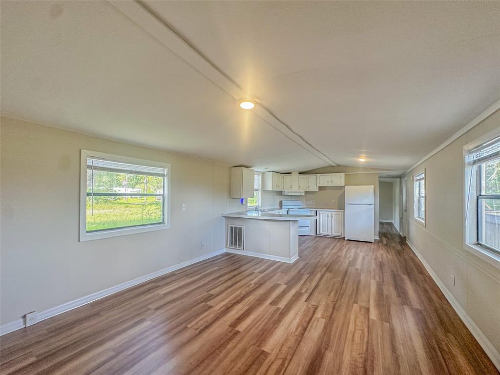 2218 Ellie Road, Unit 1 Auburndale, FL 33823 - Photo 4 of 21 a view of kitchen and wooden floor