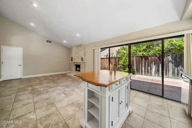 a kitchen with granite countertop a sink and a stove
