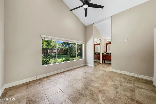 a bathroom with a glass shower door and mirror