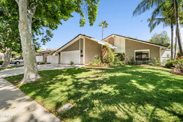 a house view with a garden space