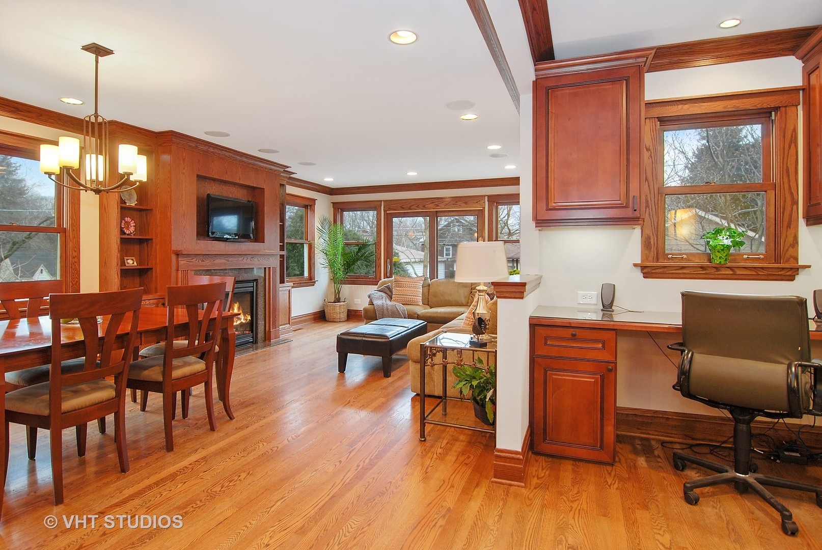 277 Gage Road Riverside, IL 60546 - Photo 14 of 36 a kitchen with stainless steel appliances granite countertop a stove a refrigerator a sink a dining table and chairs with wooden floor