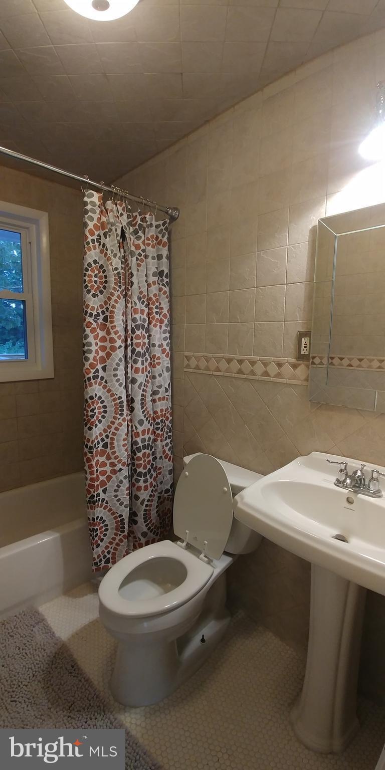 6750 Amherst Road Bryans Road, MD 20616 - Photo 13 of 15 a bathroom with a sink a toilet and shower