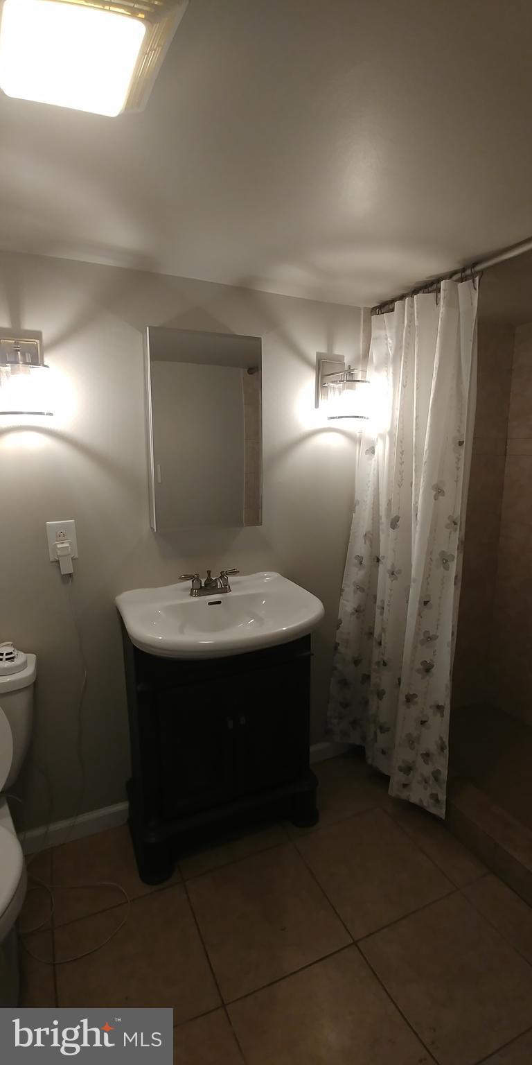 6750 Amherst Road Bryans Road, MD 20616 - Photo 7 of 15 a bathroom with a sink and a mirror