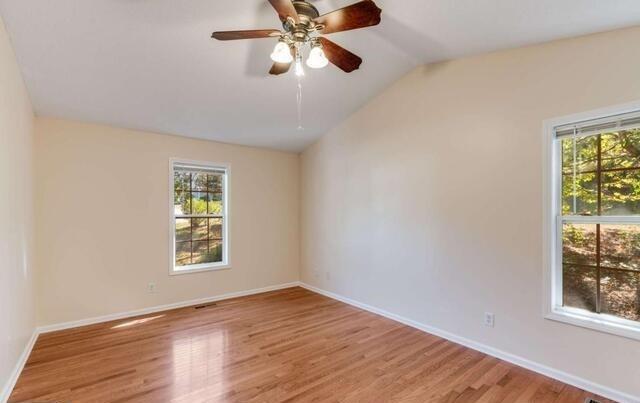 139 Clover Court Temple, GA 30179 - Photo 15 of 32 wooden floor in an empty room with a window