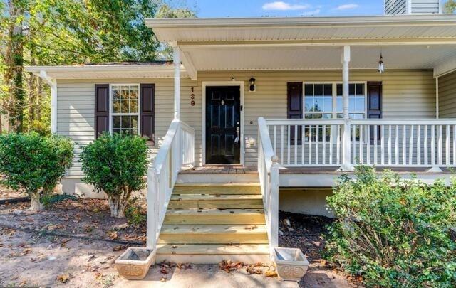 139 Clover Court Temple, GA 30179 - Photo 2 of 32 a view of a house with a small yard and plants