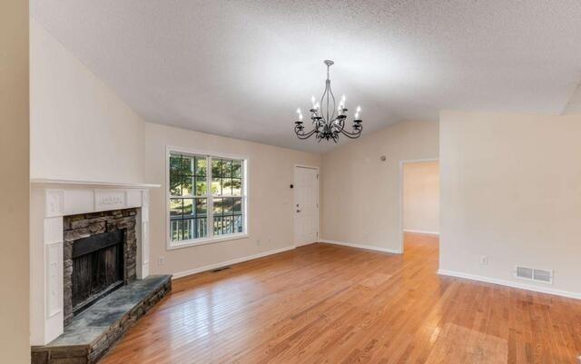 139 Clover Court Temple, GA 30179 - Photo 7 of 32 a view of a livingroom with a fireplace window and wooden floor