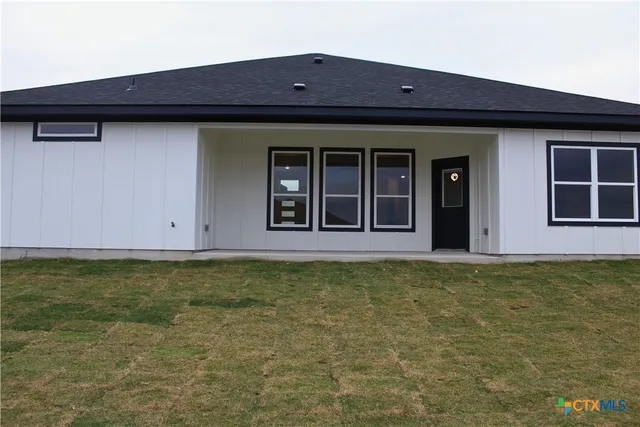 a house that has a large window in front of it