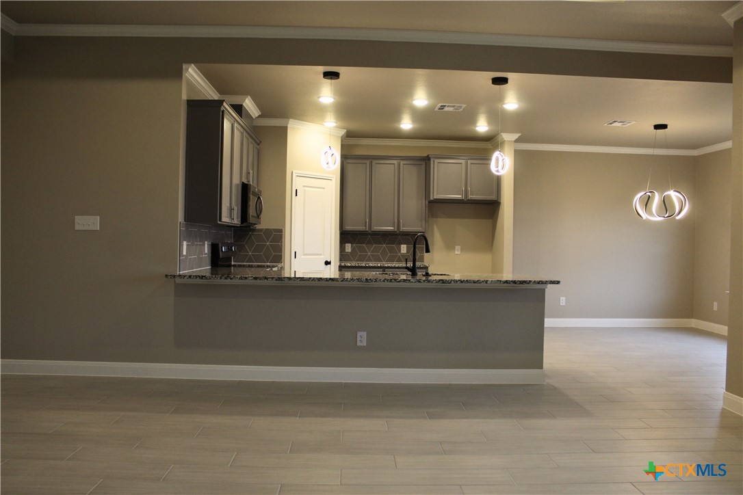 3824 Keller Road Temple, TX 76504 - Photo 4 of 22 a view of kitchen with stainless steel appliances wooden floor
