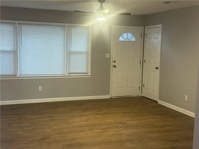 a kitchen with sink and cabinets