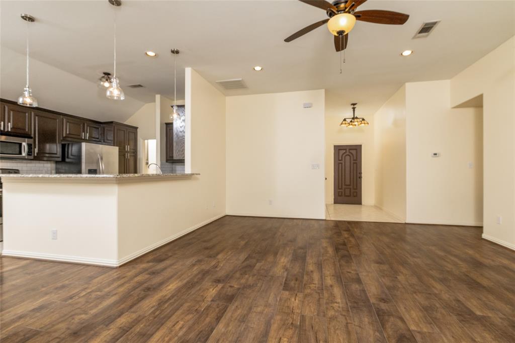 405 Kimbrough Road Azle, TX 76020 - Photo 6 of 39 a view of a kitchen with a sink and a refrigerator