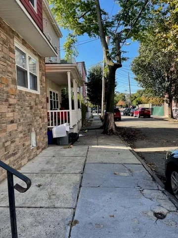 a view of a brick building with many windows