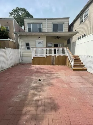 a hallway with sliding door and yard in the back
