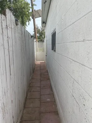 a view of parking garage with cars parked