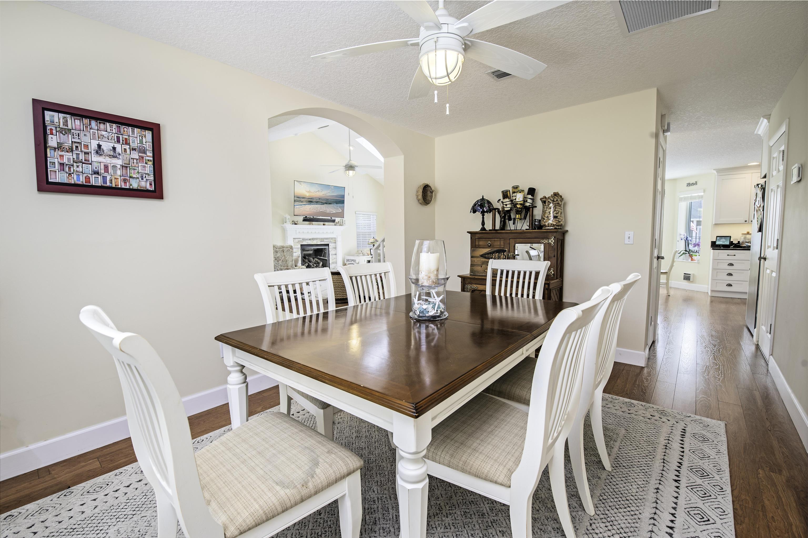 253 Treasure Beach Road St. Augustine, FL 32080 - Photo 15 of 52 a dining room with furniture and wooden floor
