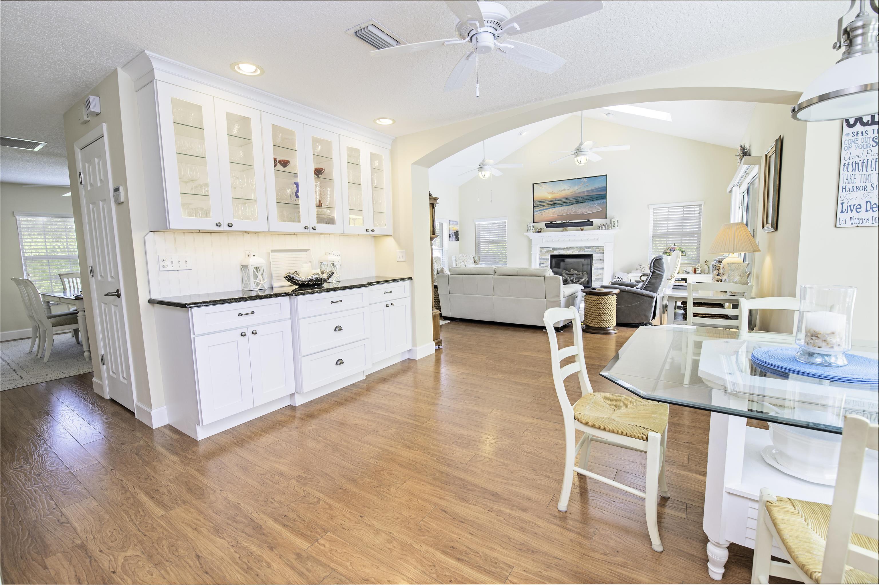 253 Treasure Beach Road St. Augustine, FL 32080 - Photo 17 of 52 a large white kitchen with a large window