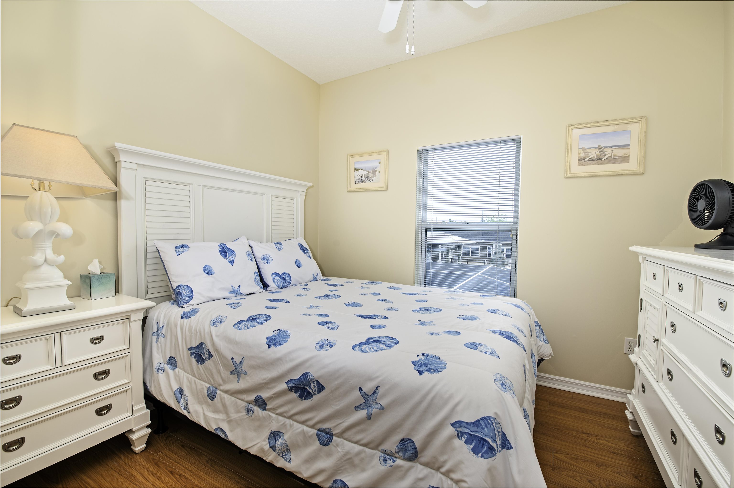 253 Treasure Beach Road St. Augustine, FL 32080 - Photo 33 of 52 a bedroom with a bed and a window in it