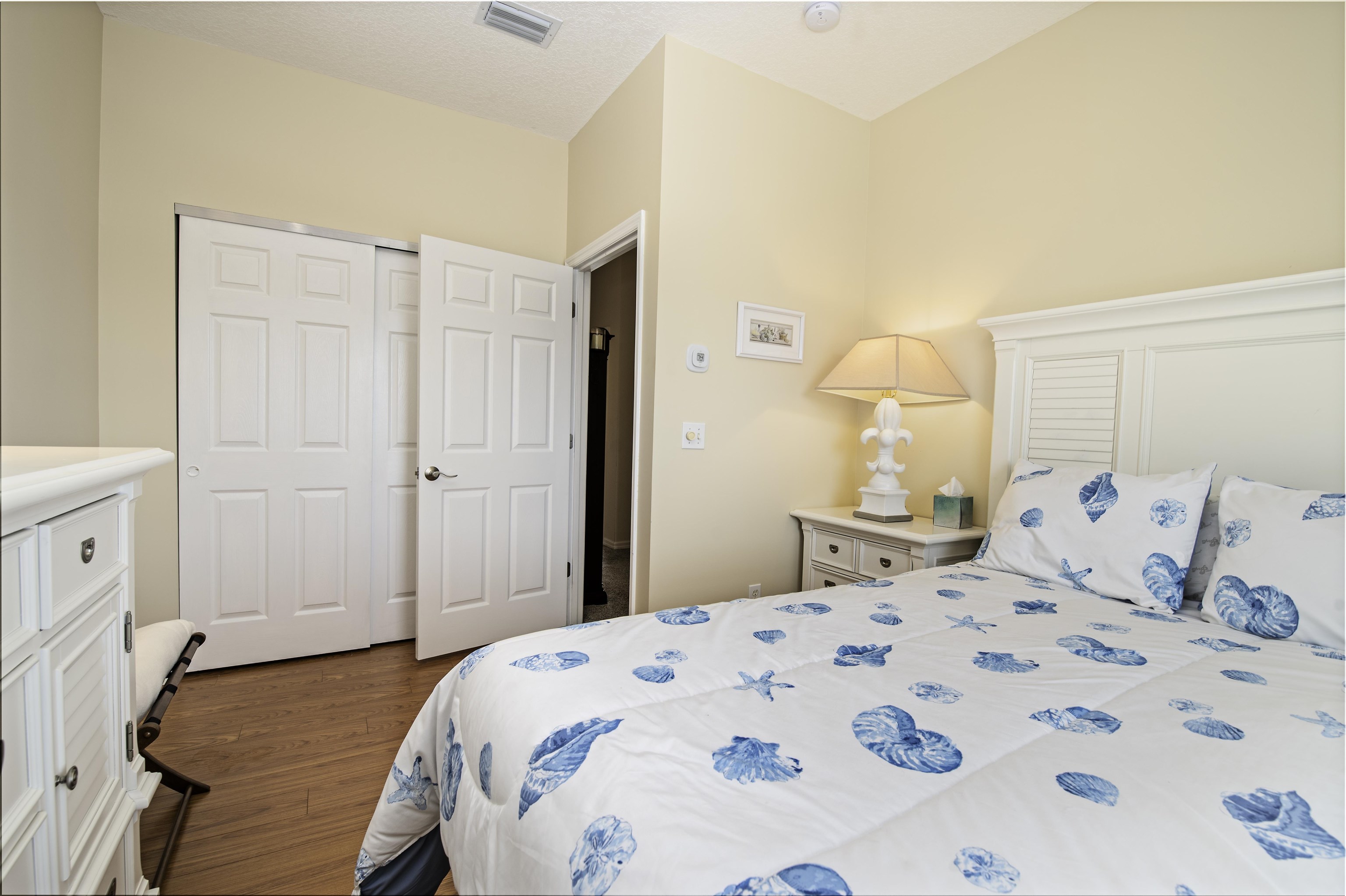 253 Treasure Beach Road St. Augustine, FL 32080 - Photo 34 of 52 a bedroom with a bed and a dresser