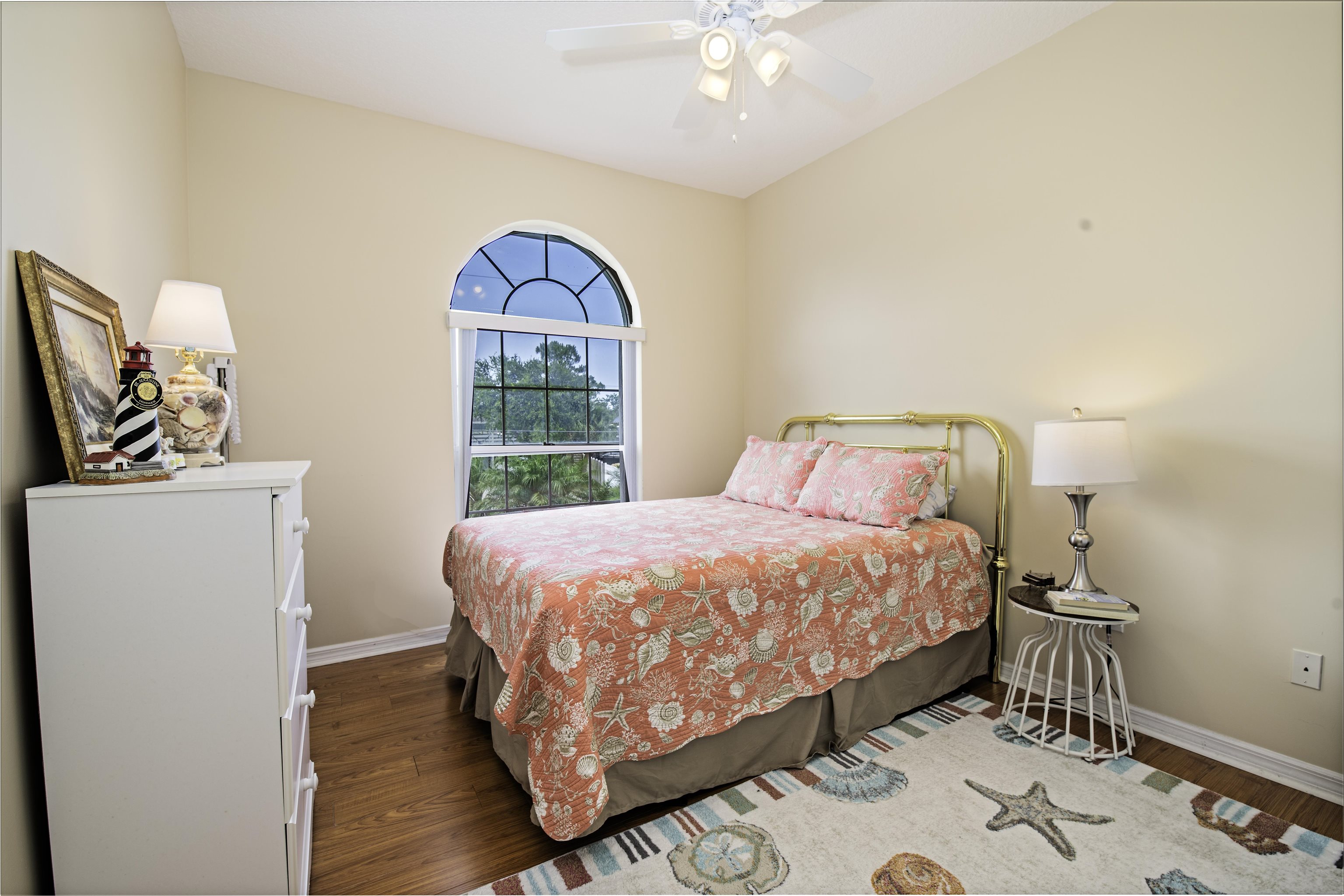 253 Treasure Beach Road St. Augustine, FL 32080 - Photo 35 of 52 a bedroom with a bed and a window