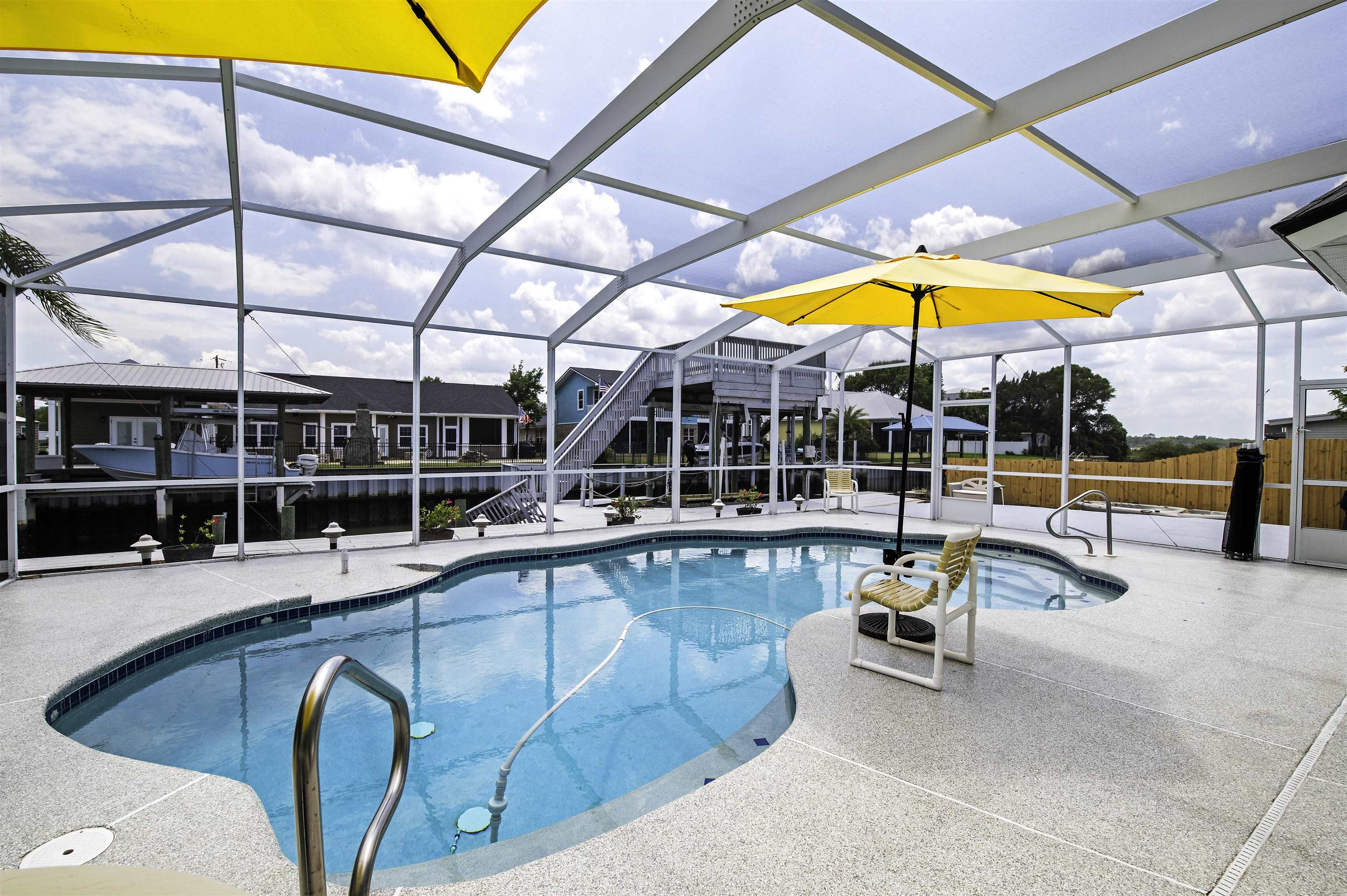 253 Treasure Beach Road St. Augustine, FL 32080 - Photo 39 of 52 a view of a swimming pool with sitting area