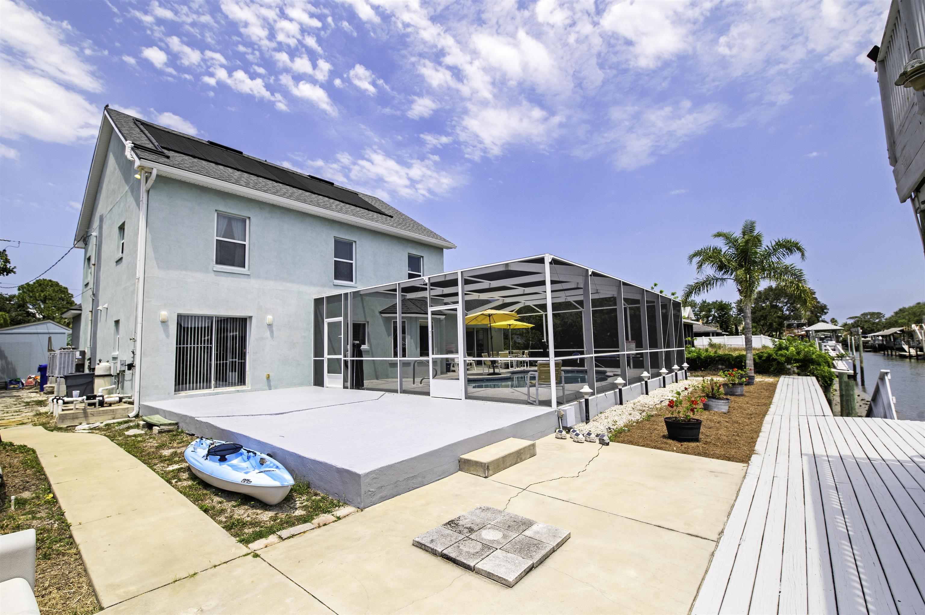 253 Treasure Beach Road St. Augustine, FL 32080 - Photo 41 of 52 a view of a patio with swimming pool