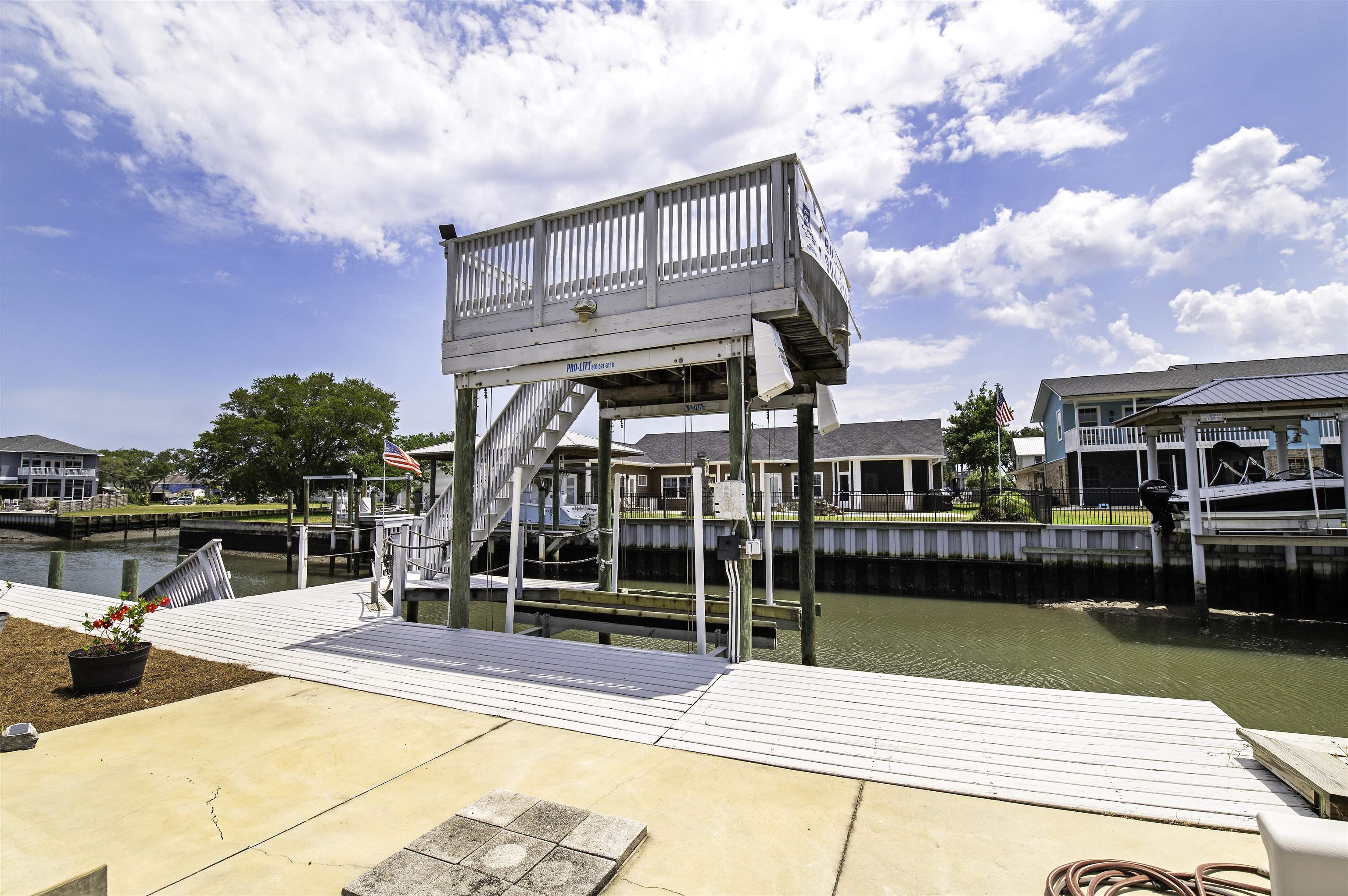 253 Treasure Beach Road St. Augustine, FL 32080 - Photo 42 of 52 a view of house with swimming pool and seating area