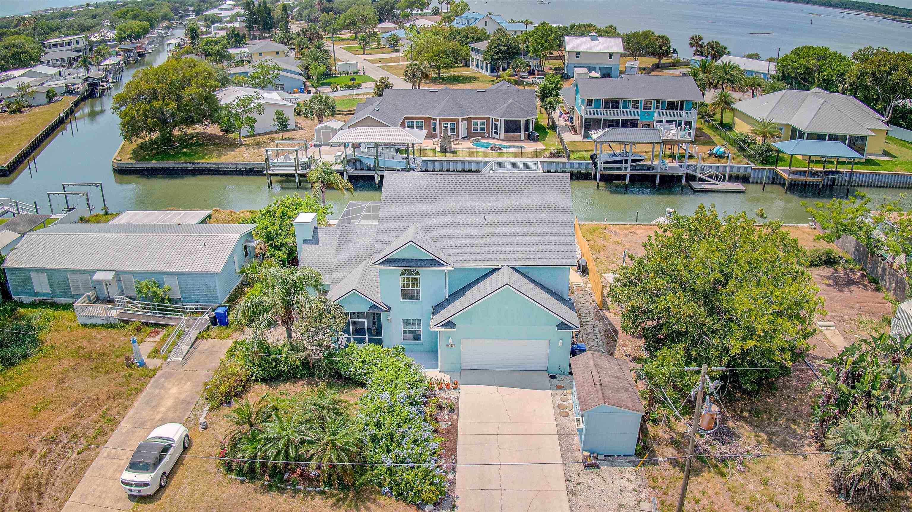253 Treasure Beach Road St. Augustine, FL 32080 - Photo 47 of 52 an aerial view of a house with a garden and lake view