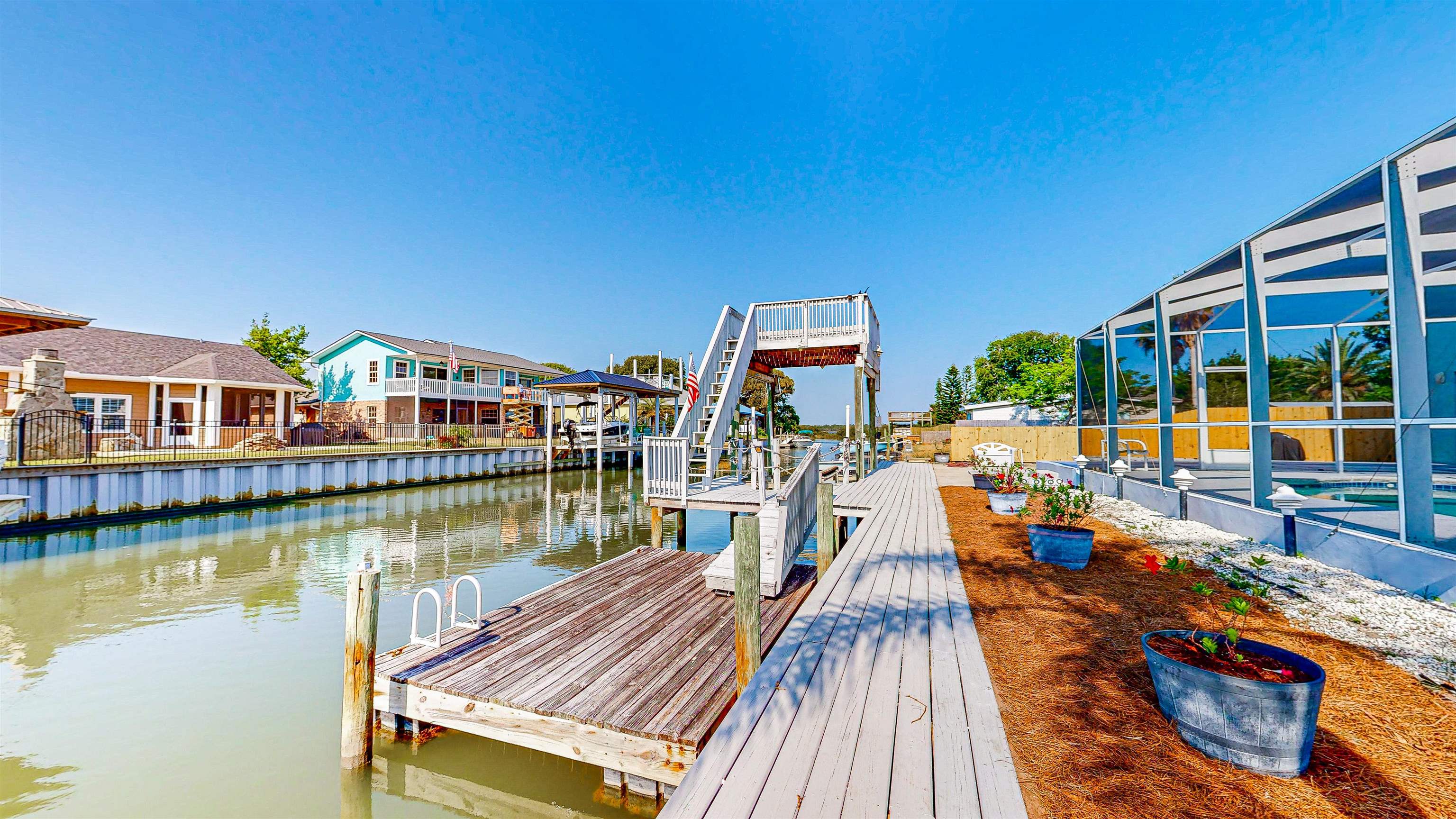 253 Treasure Beach Road St. Augustine, FL 32080 - Photo 5 of 52 a view of a lake with outdoor seating