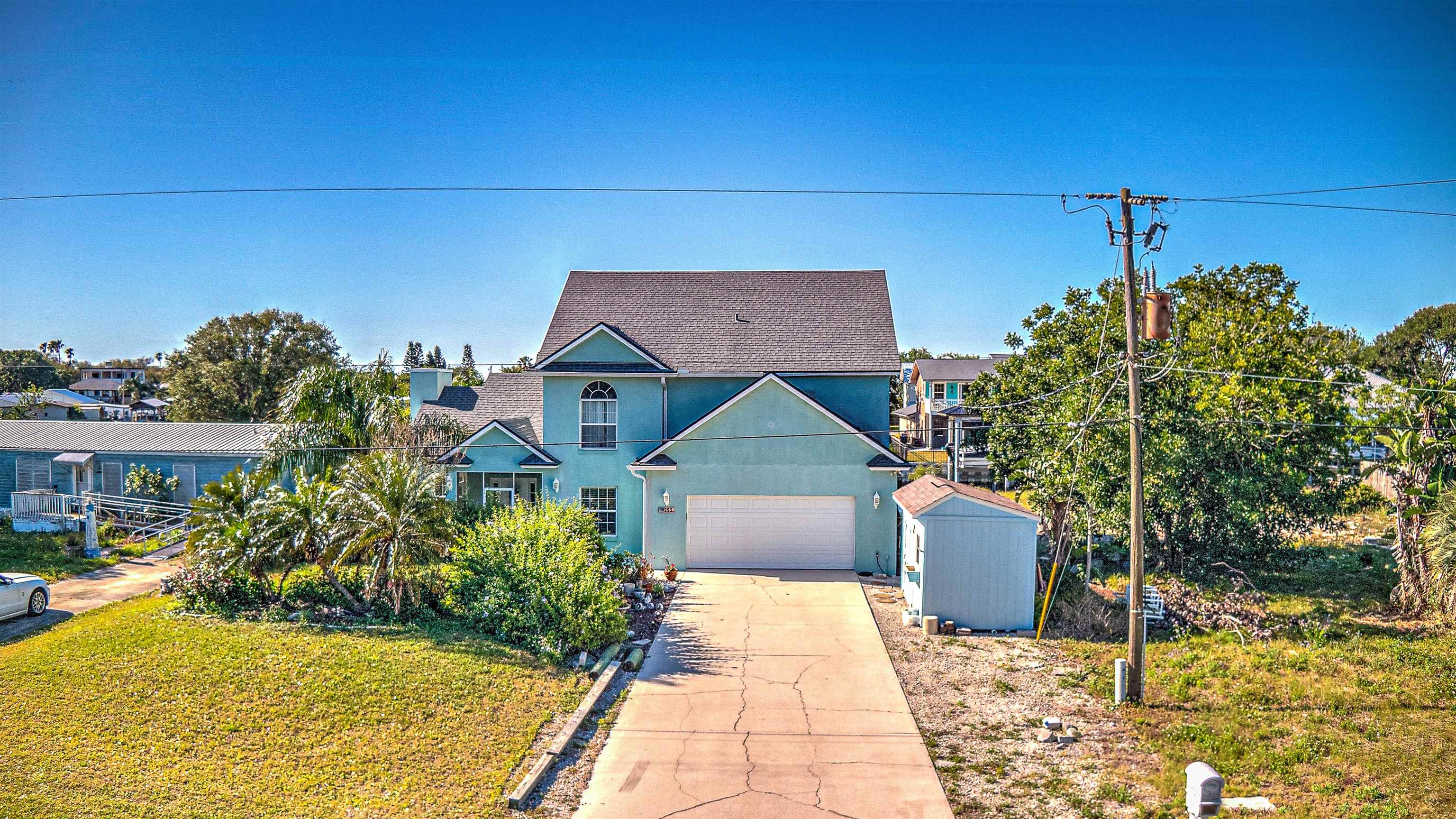 253 Treasure Beach Road St. Augustine, FL 32080 - Photo 7 of 52 a front view of a house with a yard