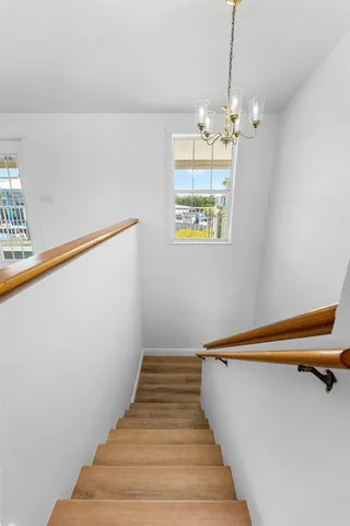 a view of a livingroom with a ceiling fan and window