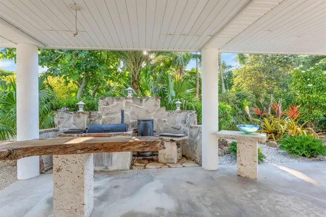 a view of a balcony with wooden floor and outdoor space